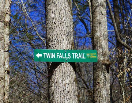 sign falls twin sc trail straight go upper heading gate forest wide around down